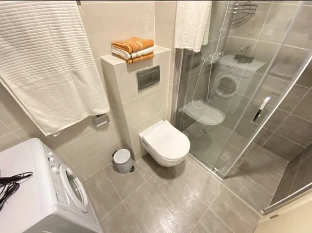 One-bedroom apartment with a jacuzzi in the living room, located in a modern building with an elevator